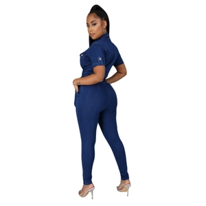 Close-up of slim fit dark blue denim jumpsuit with short sleeves and chest pockets
