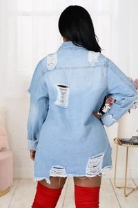 Back view of long denim jacket showing distressed ripped details and frayed hem