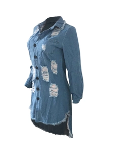 Detail showing distressed holes and frayed hem on a light blue denim shirt dress