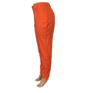 Side view of vibrant orange high waisted slim fit trousers featuring back pocket details