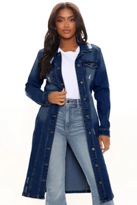 Detail of distressed ripped denim coat featuring vintage frayed holes and texture