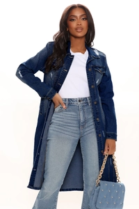 Detail view of distressed dark blue denim trench coat with button closure and chest pockets
