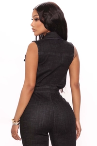 Detailed back view of a slim-fit black sleeveless denim jumpsuit with contrast stitching