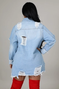 Detailed back view of light blue denim coat featuring distressed ripped holes and fringe