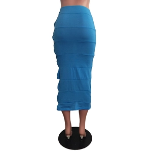 Detail of teal knit maxi skirt with horizontal layered knot design and bodycon fit