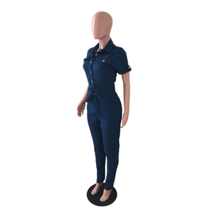Detail view of dark blue denim jumpsuit with short sleeves and waist tie belt