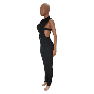 Detail of black denim bodysuit featuring side cut-outs and metallic button closures