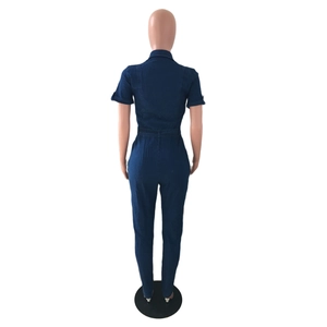 Back view of a deep blue short-sleeve denim jumpsuit with a waist belt and straight legs