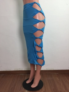 Detail view of turquoise midi skirt showing side cutout knots and high slit design