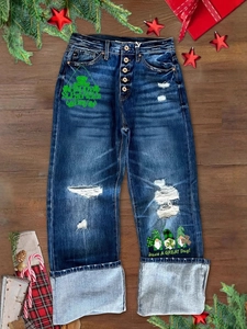 Distressed high-waisted straight jeans with St. Patrick's Day prints on dark denim