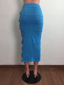 Detail showing horizontal layered design on bright blue knitted pencil skirt