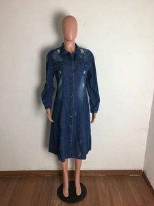 Detailed view of long sleeve denim shirt dress with ripped design and button-down front