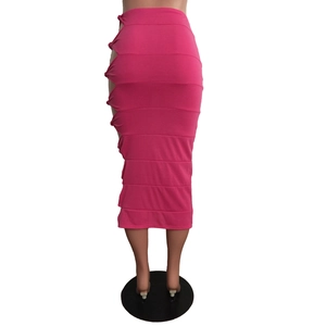Detail of rose pink midi skirt with sexy side cut-outs and knot tie decorations