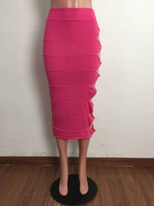Detail of fuchsia cutout skirt with horizontal tiered ruching and knotted side design