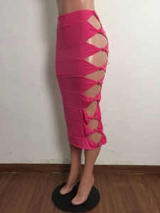 Detail of rose pink skirt featuring stylish side cutout and elegant knot design