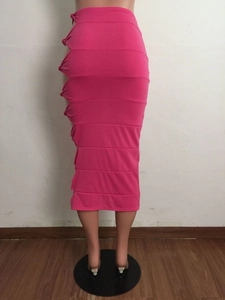 Detailed close-up of hot pink cutout skirt featuring decorative side knot accents