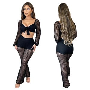 Front and back view of a black two-piece mesh beach set with crop top and wide-leg trousers