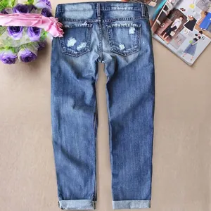 Classic straight leg blue denim jeans with vintage wash and distressed pocket detail