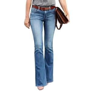 Women's slim fit flared blue jeans with brown belt and washed denim finish