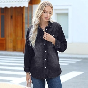 Detail of grey gradient washed denim jacket with vintage chest pockets and buttons