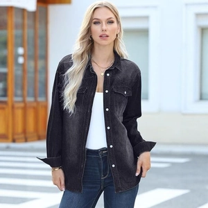 Detail of grey washed denim jacket with double chest pockets and metallic buttons