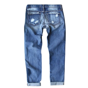 Back view of distressed blue washed denim jeans with ripped pockets and cuffed hems