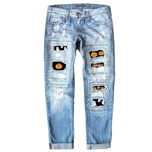 Women's light blue ripped jeans with Halloween pumpkin and ghost print details