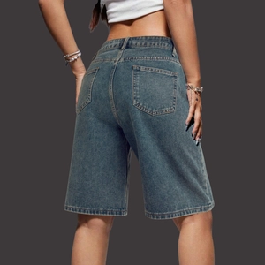 Detailed back view of high-waisted denim jorts featuring dual classic square pockets