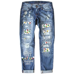 Women's blue washed distressed jeans with Christmas lights print and festive lettering