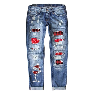 Women's straight jeans with distressed holes, red plaid patches, and Christmas sequins