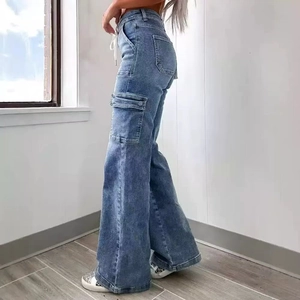 Women's blue washed high waist cargo jeans with wide leg cut and side flap pockets