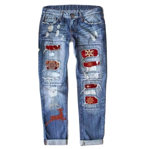Women's mid-rise straight jeans with Christmas prints, reindeer patches and ripped details