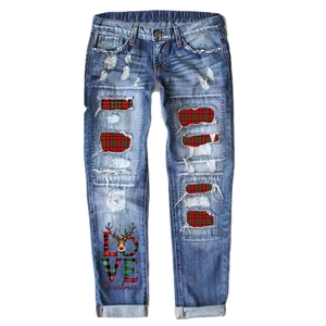 Women Christmas ripped straight jeans with festive plaid patches and reindeer print