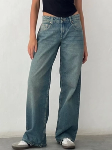 Vintage light blue high-waisted wide-leg denim jeans with a retro washed finish for women