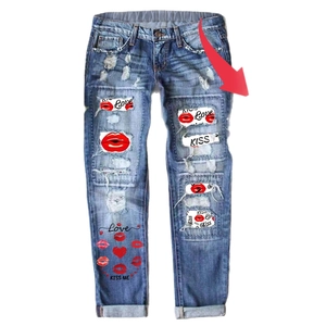 Women's blue distressed straight jeans with red lip print and kiss lettering inserts