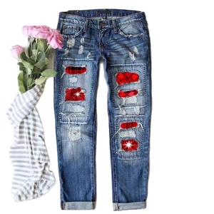 Distressed blue slim jeans for women with red plaid and sparkling heart sequin patches