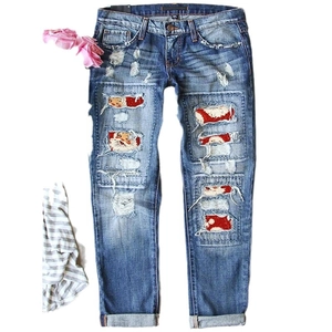 Light blue slim fit ripped jeans with festive Santa Claus print patches for Christmas