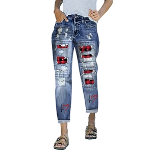 Women's blue distressed jeans with plaid patches and red heart heartbeat prints