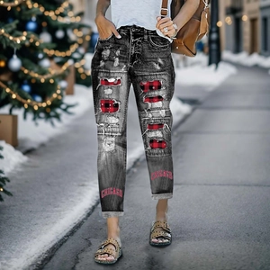 Distressed black jeans with Christmas plaid patches and Chicago print on snowy background