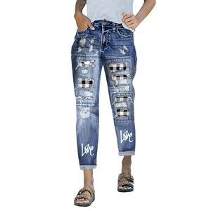 Women's blue ripped jeans with black and white plaid patches and Love print