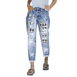 Women's light blue ripped jeans with plaid patches and Love graphic print designs