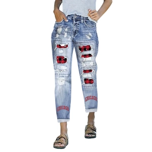 Women's light blue distressed jeans with buffalo plaid patches and Chicago print