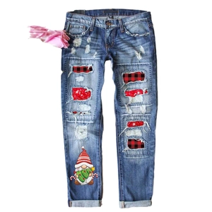 Women light blue ripped denim jeans with festive Christmas gnome and red plaid patches