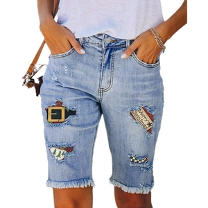 Women's light blue denim Bermuda shorts with festive Christmas patches and frayed hems
