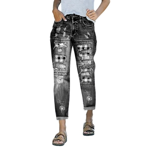 Women's dark gray ripped jeans with white dandelion print and plaid patch details