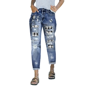 Deep blue ripped jeans with dandelion print, plaid patches, and cuffed straight leg fit