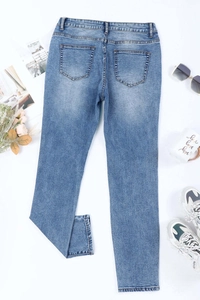 Back view of light blue straight denim jeans with sparkling heart print and washed finish