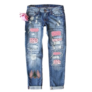 Women's slim straight denim jeans with Christmas tree print and sequin leopard patches