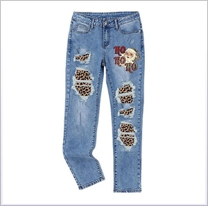 Women's blue straight-leg Santa jeans with leopard print patches and holiday lettering