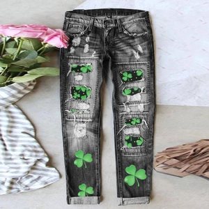Mid-rise straight leg dark grey distressed jeans with green shamrock clover prints